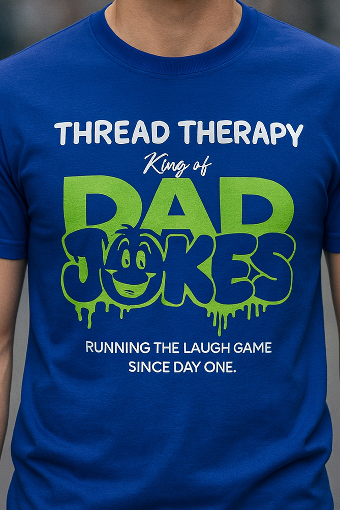Man wearing a blue t-shirt with 'Thread Therapy King of Dad Jokes' text